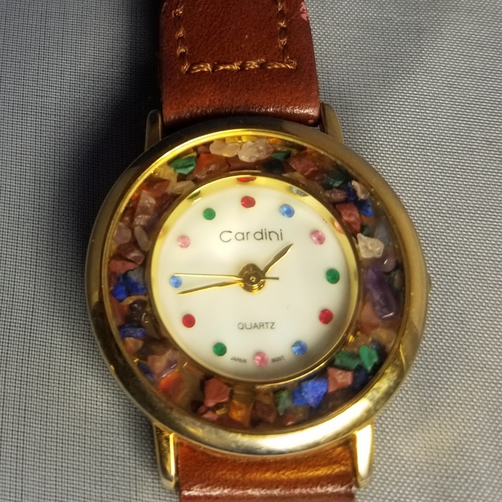 Cardini watch surrounded by precious stones